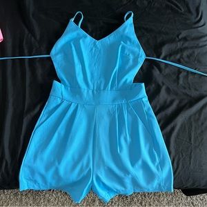 Blue backless shorts romper w/ pockets.